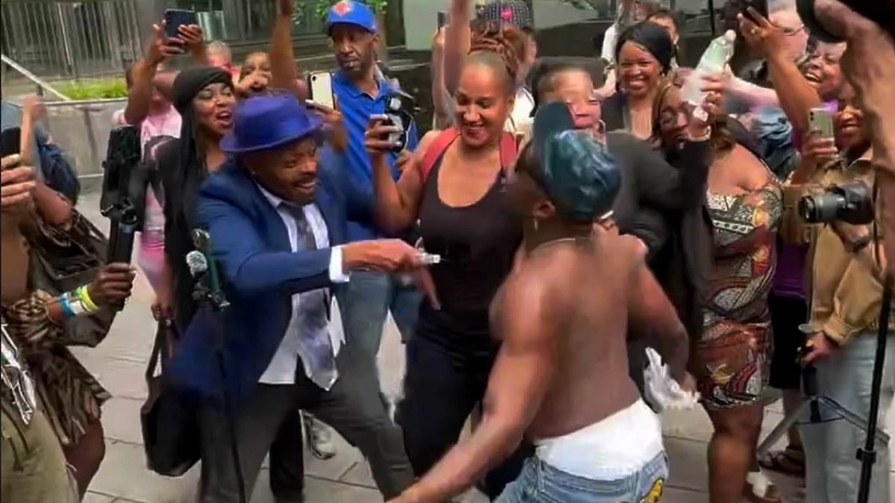 Diddy fans removed by riot police after spraying baby oil