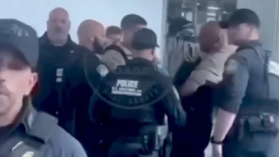 Famous rapper is handcuffed and arrested while trying to board flight