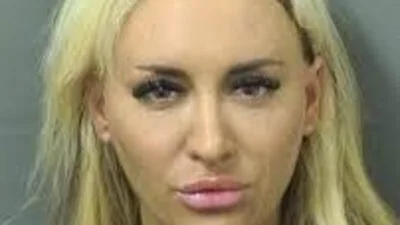 Fox News host rape accuser pouts in mugshot after arrest for battery