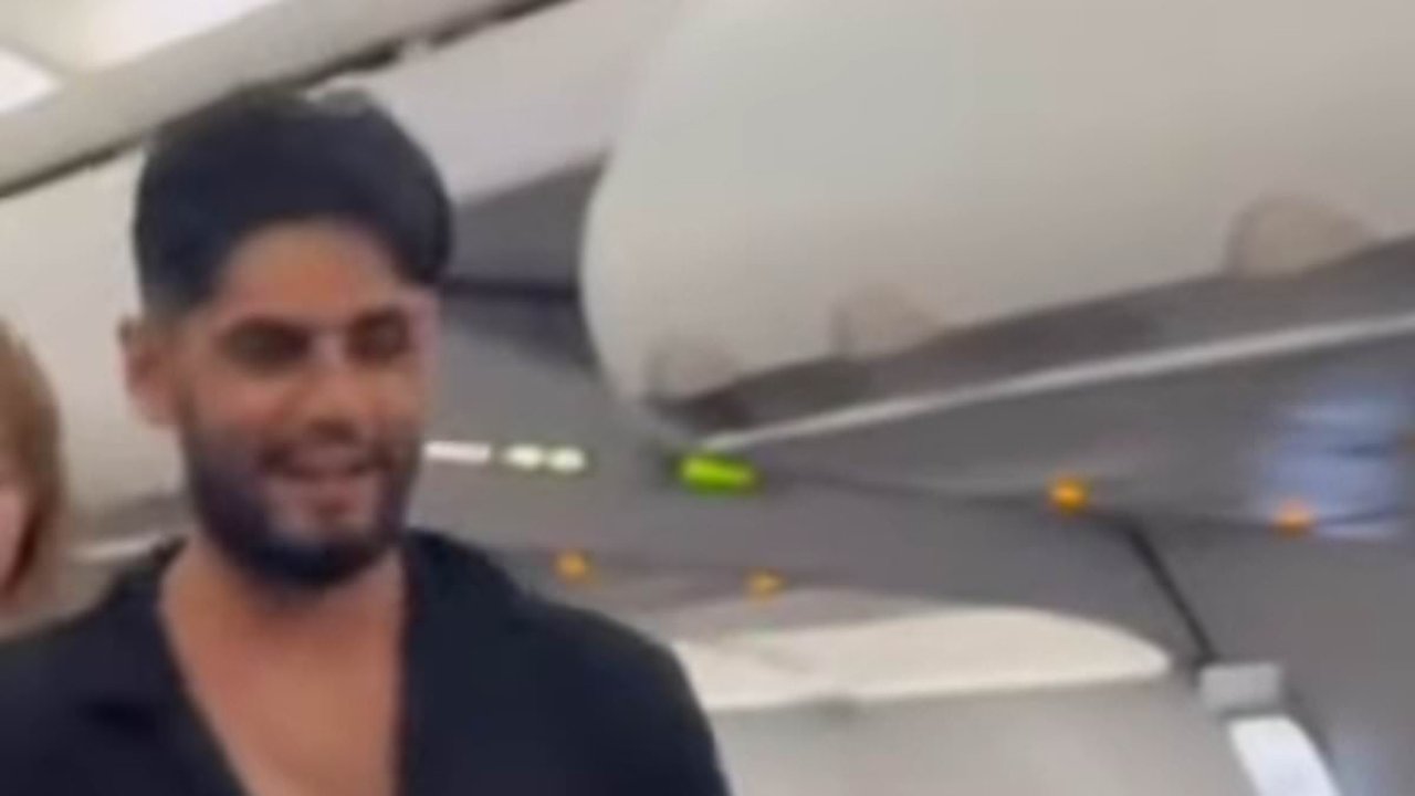 Frontier passenger, 21, seen CACKLING after mid-air brawl