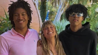 Heidi Klum is dwarfed by sons Henry, 19, and Johan, 18