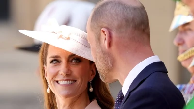 Kate looks radiant as she greets French president Emmanuel Macron