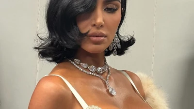 Kim Kardashian channels her idol Elizabeth Taylor in slip dress