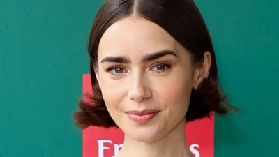 Lily Collins enjoys break from parenting duties at Wimbledon