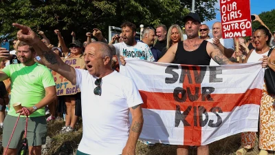 Protest at migrant hotel explodes into violence after rivals clash