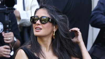 Salma Hayek, 58, embraces her natural grey hair at Paris Fashion Week