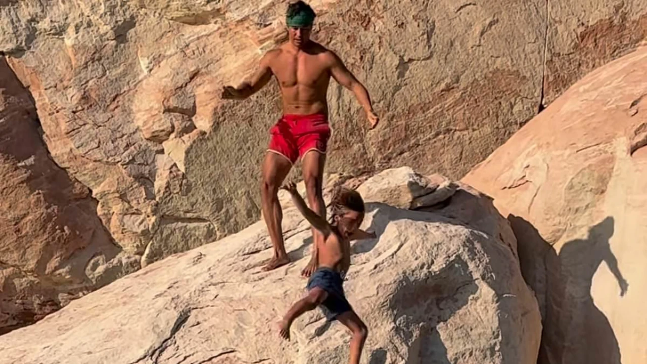 Travel influencer sparks fury after throwing son off a cliff