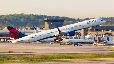 Packed Delta plane clips wing of huge Airbus as it prepared to depart